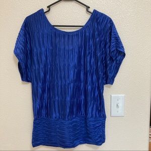 Blue dolman style stop with cut out back